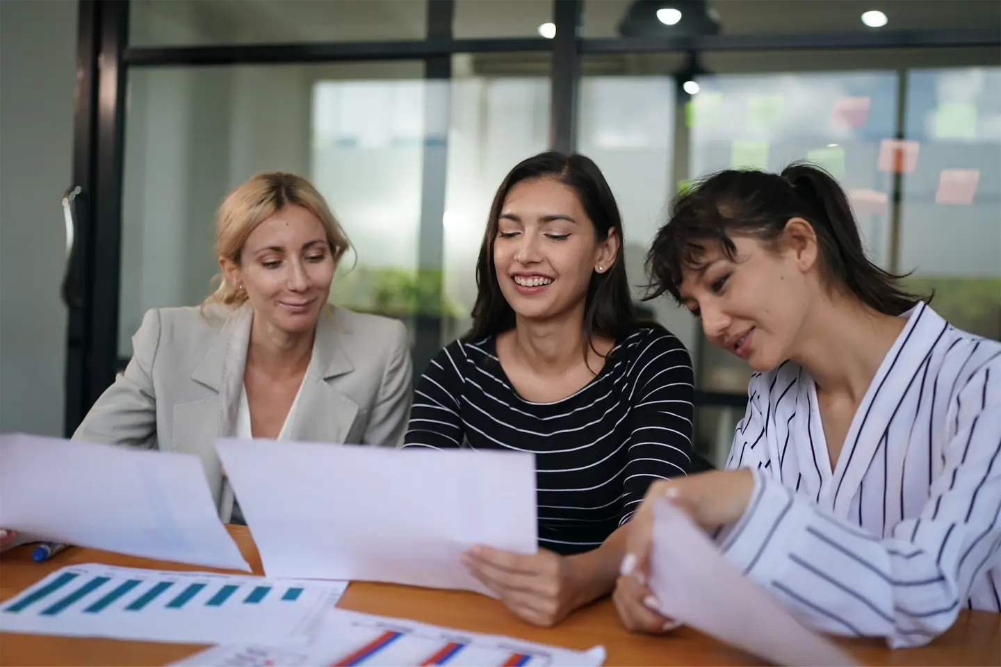 Businesswoman making business presentation for colleagues in modern office